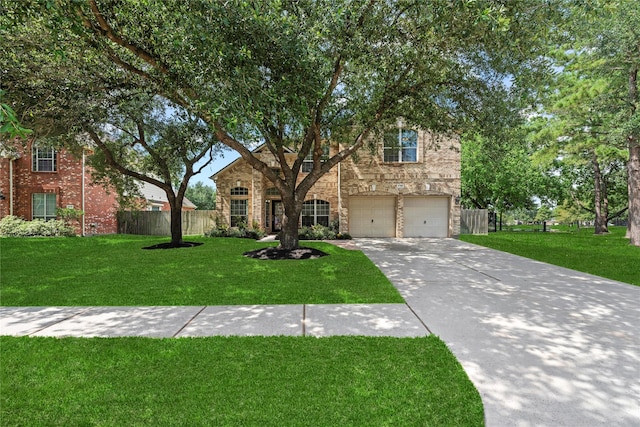 17706 Riata Lake Dr, Cypress, TX 77433 - view of front facade with stone siding, driveway, and a garage