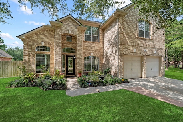 17706 Riata Lake Dr, Cypress, TX 77433 - view of front facade featuring concrete driveway, brick siding, and a garage