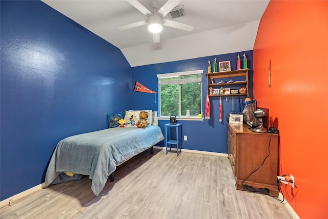 17706 Riata Lake Dr, Cypress, TX 77433 - bedroom with vaulted ceiling, wood finished floors, and a ceiling fan