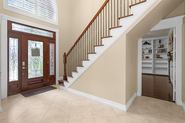 9311 Windrush Dr, Spring, TX 77379 - tiled foyer entrance with plenty of natural light, stairs, and a high ceiling