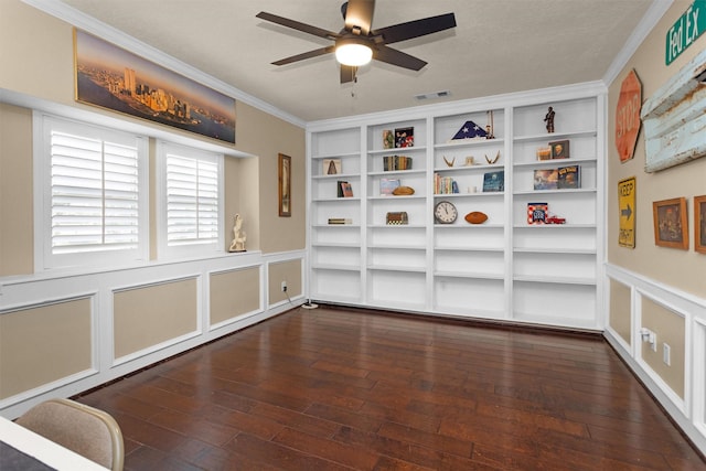 9311 Windrush Dr, Spring, TX 77379 - unfurnished room featuring a ceiling fan, crown molding, hardwood / wood-style floors, built in features, and a wainscoted wall