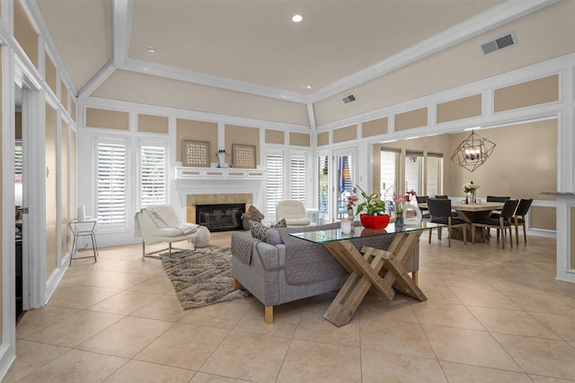 9311 Windrush Dr, Spring, TX 77379 - living area with light tile patterned flooring, a high end fireplace, a chandelier, recessed lighting, and ornamental molding