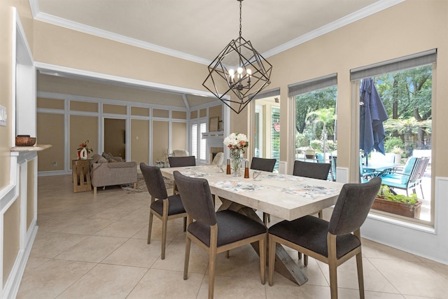 9311 Windrush Dr, Spring, TX 77379 - dining room featuring ornamental molding, a chandelier, and light tile patterned floors