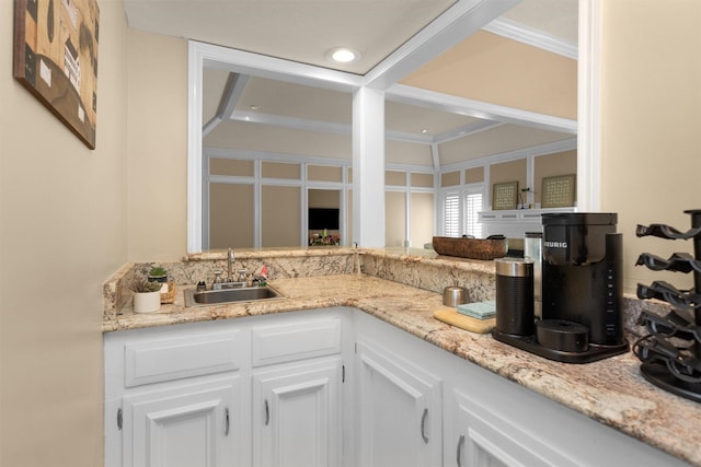 9311 Windrush Dr, Spring, TX 77379 - kitchen with white cabinetry and light stone countertops