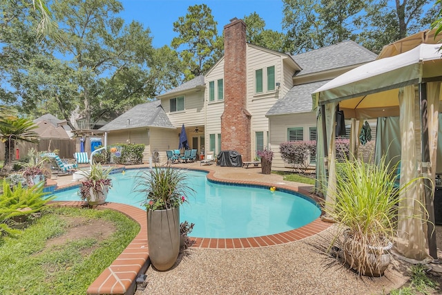 9311 Windrush Dr, Spring, TX 77379 - view of swimming pool with a patio area