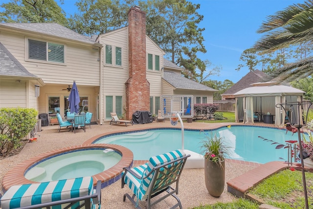 9311 Windrush Dr, Spring, TX 77379 - view of swimming pool featuring a gazebo, an in-ground hot tub, a patio area, and a ceiling fan