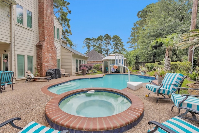 9311 Windrush Dr, Spring, TX 77379 - view of swimming pool with a patio and a pool with connected hot tub
