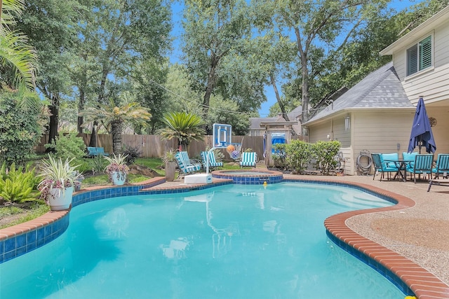 9311 Windrush Dr, Spring, TX 77379 - view of swimming pool featuring a fenced backyard, a patio, and a pool with connected hot tub