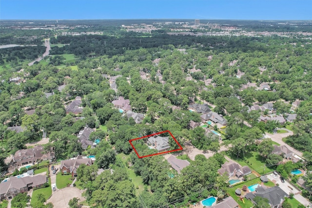 9311 Windrush Dr, Spring, TX 77379 - aerial view of property and surrounding area with property boundaries highlighted and nearby suburban area