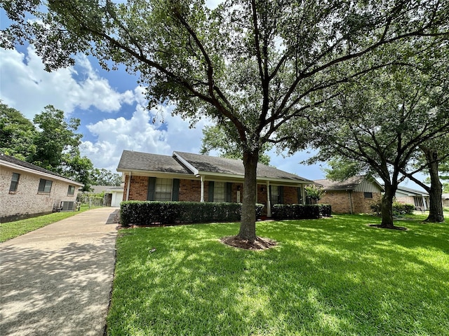 5818 Birchmont Dr, Houston, TX 77092 - single story home with brick siding, a front yard, and a garage
