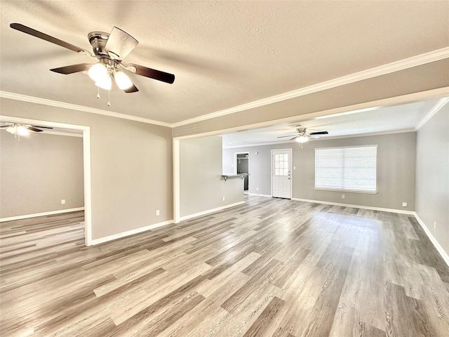5818 Birchmont Dr, Houston, TX 77092 - unfurnished living room with a ceiling fan, wood finished floors, ornamental molding, and a textured ceiling