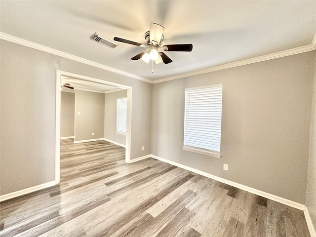 5818 Birchmont Dr, Houston, TX 77092 - spare room with a ceiling fan, wood finished floors, healthy amount of natural light, and ornamental molding