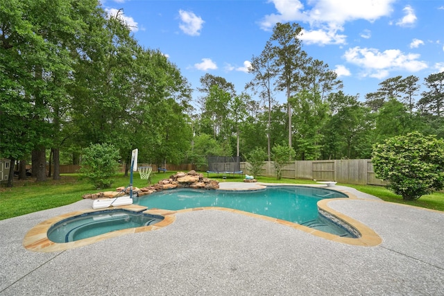 14014 Lakewood Crossing Blvd, Houston, TX 77070 - view of swimming pool with a trampoline, a fenced backyard, a patio area, and view of wooded area
