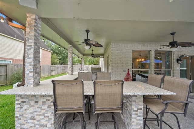14014 Lakewood Crossing Blvd, Houston, TX 77070 - view of patio featuring a ceiling fan, a grill, and an outdoor bar