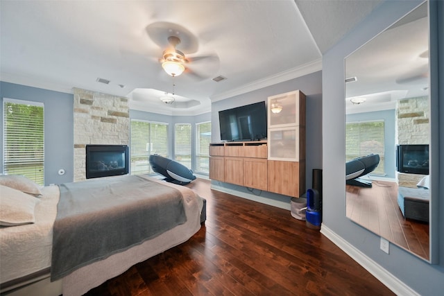 14014 Lakewood Crossing Blvd, Houston, TX 77070 - bedroom featuring a fireplace, dark wood finished floors, crown molding, and multiple windows