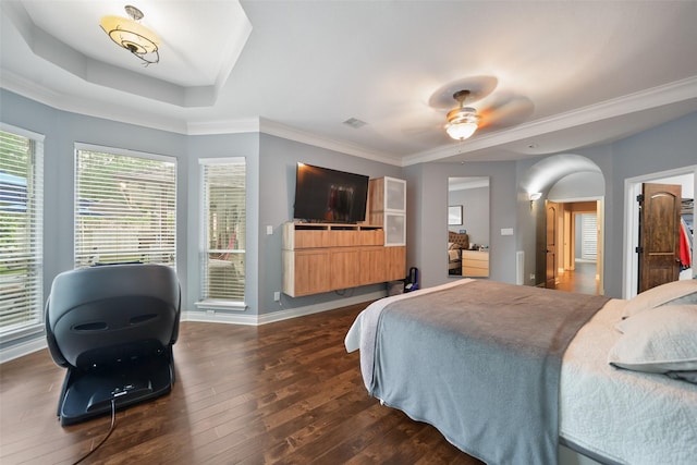 14014 Lakewood Crossing Blvd, Houston, TX 77070 - bedroom with dark wood finished floors, crown molding, access to exterior, a ceiling fan, and arched walkways
