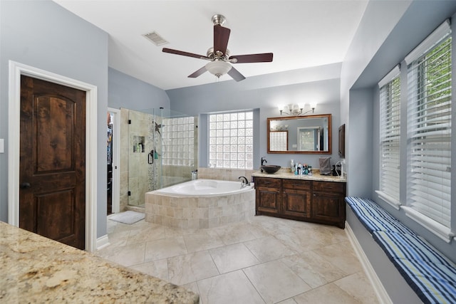 14014 Lakewood Crossing Blvd, Houston, TX 77070 - full bathroom featuring healthy amount of natural light, vanity, a bath, and a stall shower