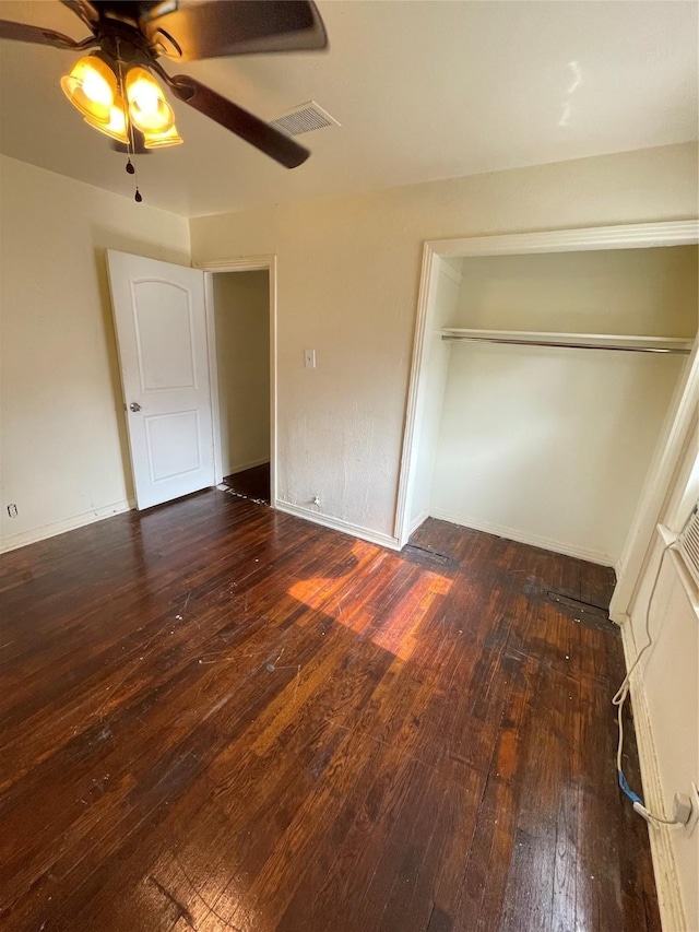 7539 Carothers St, Houston, TX 77028 - unfurnished bedroom featuring wood-type flooring, ceiling fan, and a closet