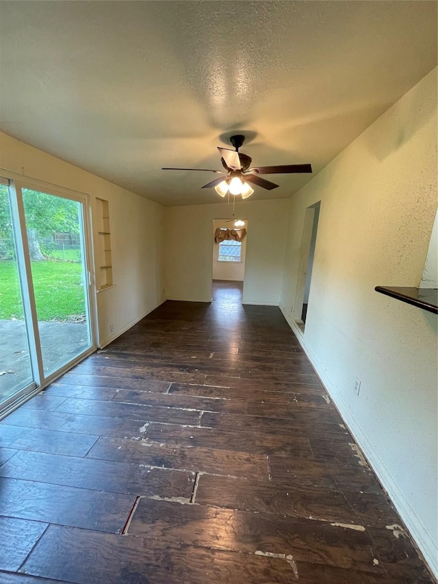 7539 Carothers St, Houston, TX 77028 - spare room featuring hardwood / wood-style flooring, a ceiling fan, and a textured ceiling