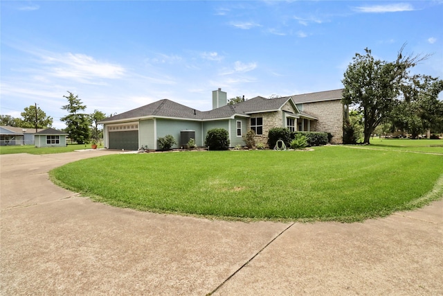 105 Sally Lake Ct, Angleton, TX 77515 - view of front facade with stone siding, concrete driveway, a garage, and a front yard