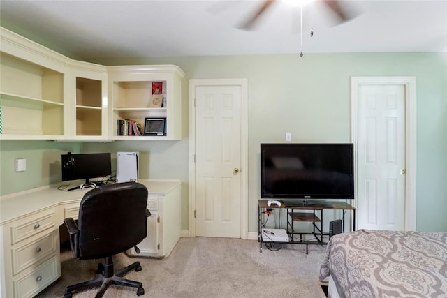 105 Sally Lake Ct, Angleton, TX 77515 - bedroom with light colored carpet, built in desk, and a ceiling fan