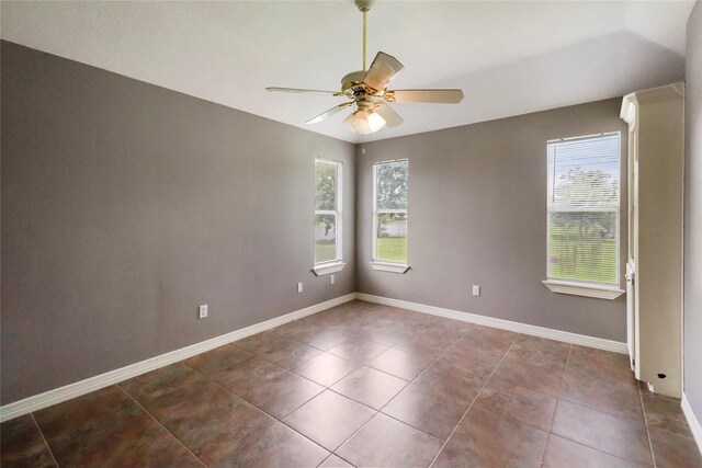 105 Sally Lake Ct, Angleton, TX 77515 - tiled spare room featuring ceiling fan and baseboards