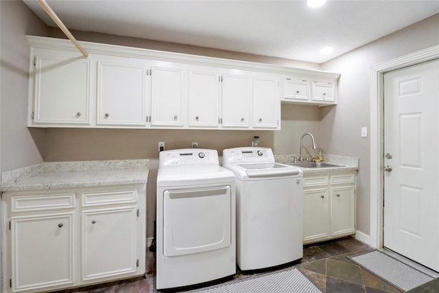 105 Sally Lake Ct, Angleton, TX 77515 - laundry room featuring cabinet space, washing machine and clothes dryer, dark stone finish floors, and recessed lighting