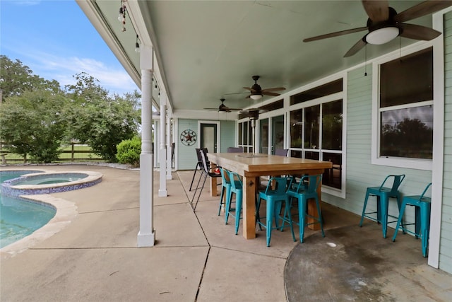 105 Sally Lake Ct, Angleton, TX 77515 - view of patio / terrace with a ceiling fan, outdoor dining area, and a pool with connected hot tub