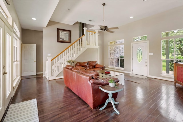 105 Sally Lake Ct, Angleton, TX 77515 - living room with stairs, dark wood-style flooring, a ceiling fan, recessed lighting, and a high ceiling