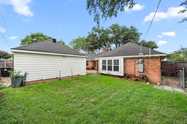 6055 Golden Forest Dr, Houston, TX 77092 - rear view of house featuring a shingled roof and a chimney