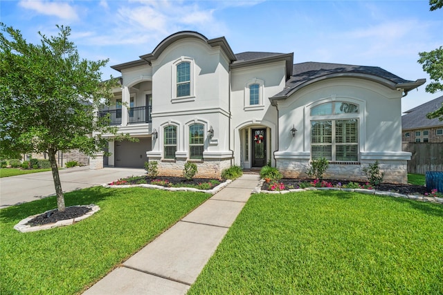 1002 Pleasant Pines Ln, Pinehurst, TX 77362 - french country inspired facade with a balcony, stucco siding, a garage, driveway, and a front yard