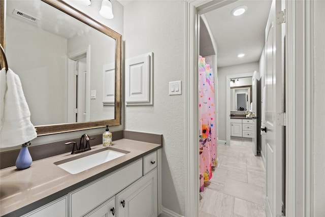 1002 Pleasant Pines Ln, Pinehurst, TX 77362 - bathroom with vanity, marble finish floors, curtained shower, and recessed lighting