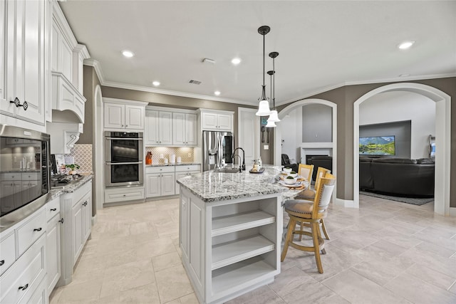 1002 Pleasant Pines Ln, Pinehurst, TX 77362 - kitchen with stainless steel appliances, open shelves, ornamental molding, backsplash, and white cabinets