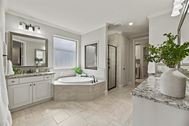 1002 Pleasant Pines Ln, Pinehurst, TX 77362 - full bathroom with a stall shower, vanity, a bath, crown molding, and washer / dryer