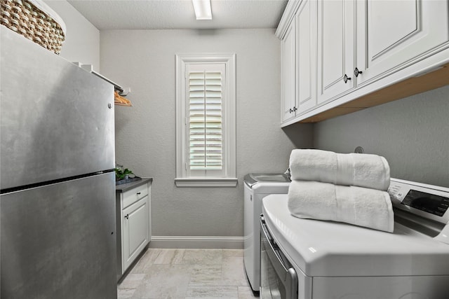 1002 Pleasant Pines Ln, Pinehurst, TX 77362 - laundry area featuring cabinet space and washer and dryer