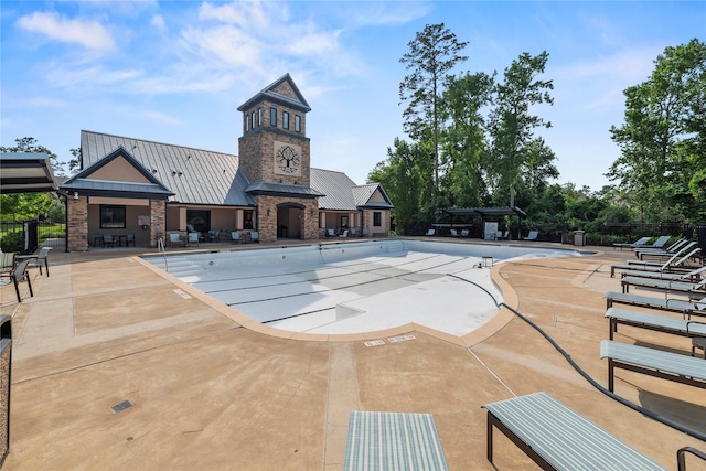 1002 Pleasant Pines Ln, Pinehurst, TX 77362 - community pool featuring a patio area