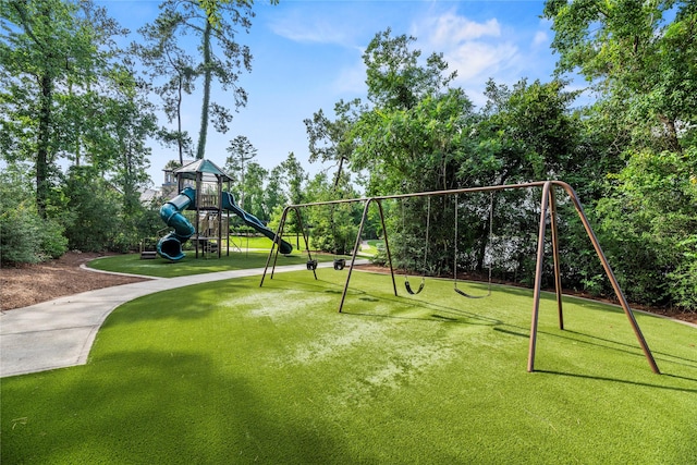 1002 Pleasant Pines Ln, Pinehurst, TX 77362 - communal playground featuring a lawn
