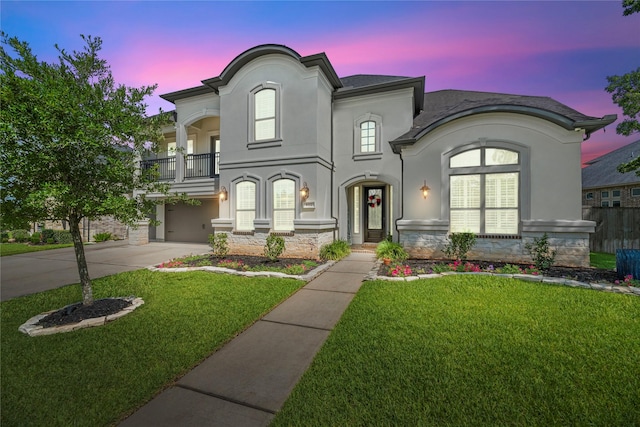 1002 Pleasant Pines Ln, Pinehurst, TX 77362 - view of front of home with a balcony, stucco siding, concrete driveway, a front yard, and an attached garage