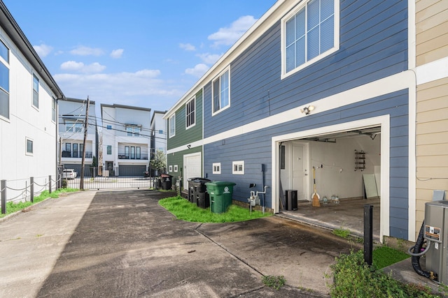 2919 Gillespie St, Houston, TX 77020 - view of home's exterior featuring asphalt driveway and a garage