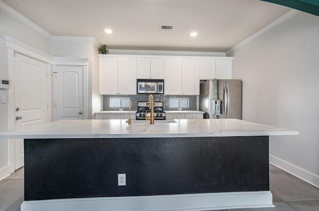 2919 Gillespie St, Houston, TX 77020 - kitchen featuring appliances with stainless steel finishes, a spacious island, crown molding, backsplash, and white cabinets