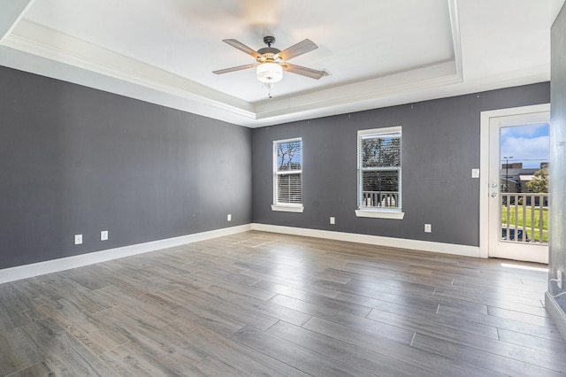 2919 Gillespie St, Houston, TX 77020 - unfurnished room featuring a raised ceiling, ceiling fan, and wood finished floors