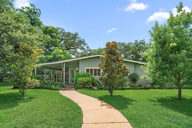 1908 Milam St, Columbus, TX 78934 - mid-century inspired home featuring a front yard and board and batten siding