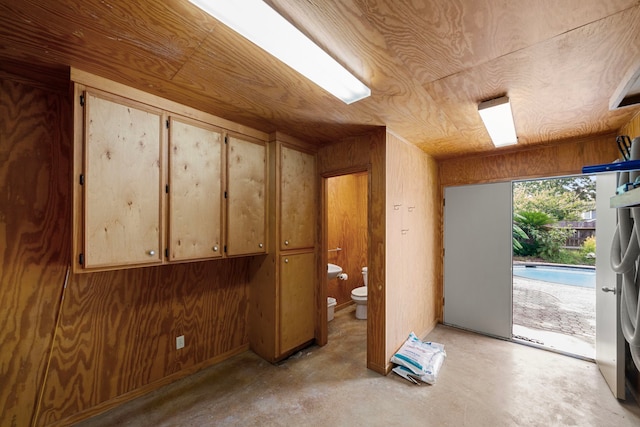 1908 Milam St, Columbus, TX 78934 - interior space featuring unfinished concrete flooring and wood walls
