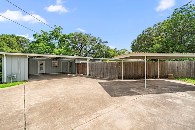 1908 Milam St, Columbus, TX 78934 - garage with driveway and a carport