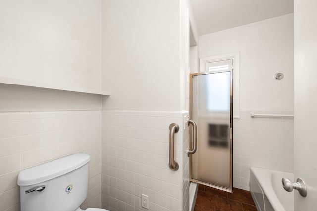 1908 Milam St, Columbus, TX 78934 - full bath with tile walls, a wainscoted wall, an enclosed shower, and a bathtub