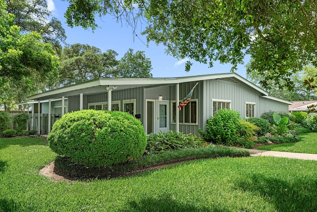 1908 Milam St, Columbus, TX 78934 - view of front of home with board and batten siding