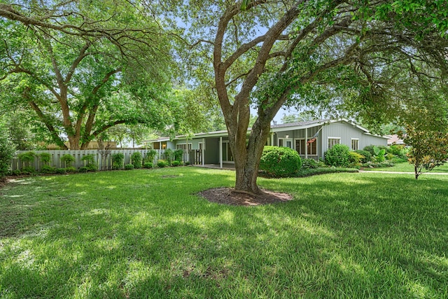 1908 Milam St, Columbus, TX 78934 - view of yard with a carport and a sunroom