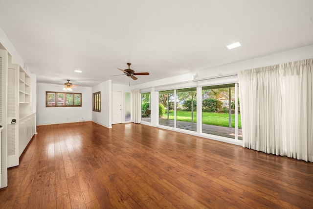 1908 Milam St, Columbus, TX 78934 - unfurnished living room with a ceiling fan, healthy amount of natural light, and hardwood / wood-style flooring