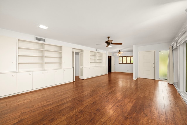 1908 Milam St, Columbus, TX 78934 - unfurnished living room featuring a ceiling fan, dark wood finished floors, and built in features
