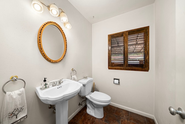 1908 Milam St, Columbus, TX 78934 - half bath with baseboards and stone finish floors